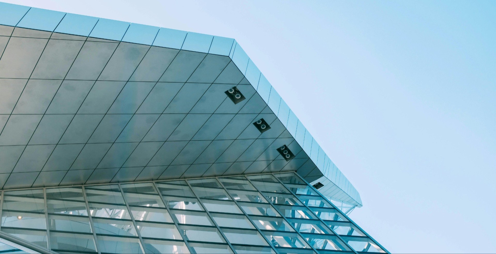 closeup of top of building with blue sky