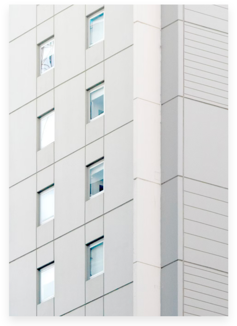 closeup of light grey building with windows