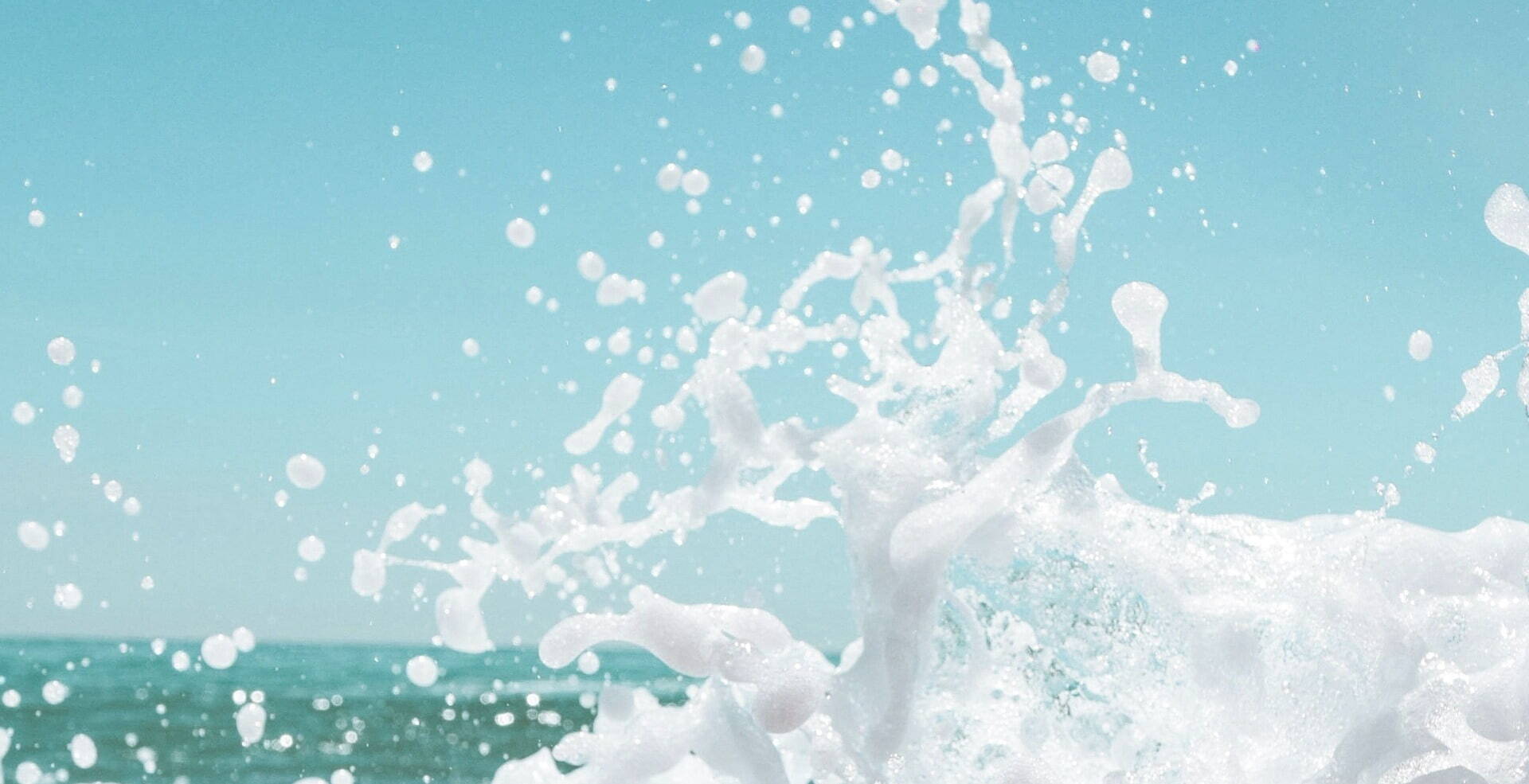 ocean splash with blue sky