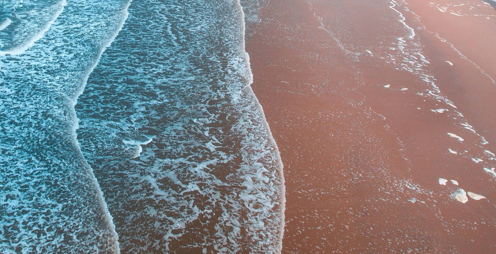 pastel waves against beach