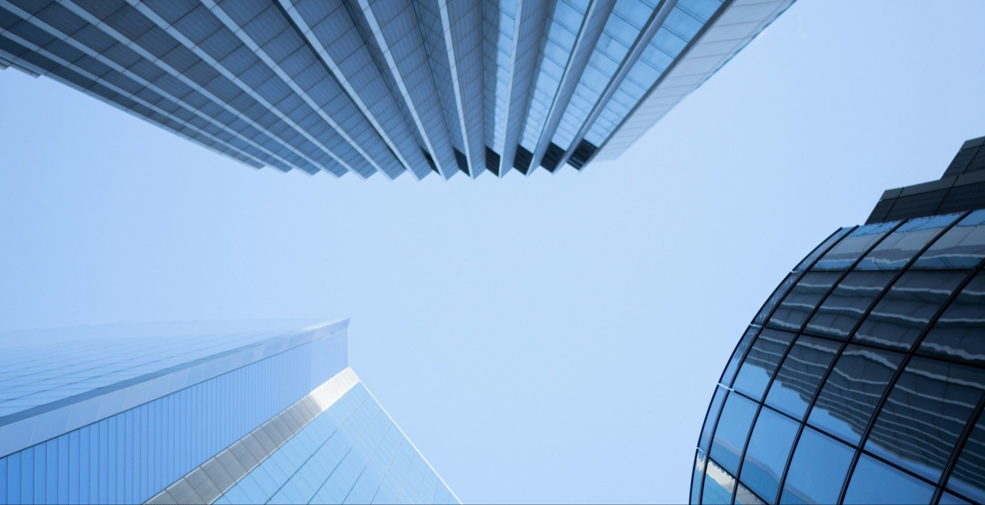 Worm's view of office buildings and blue sky